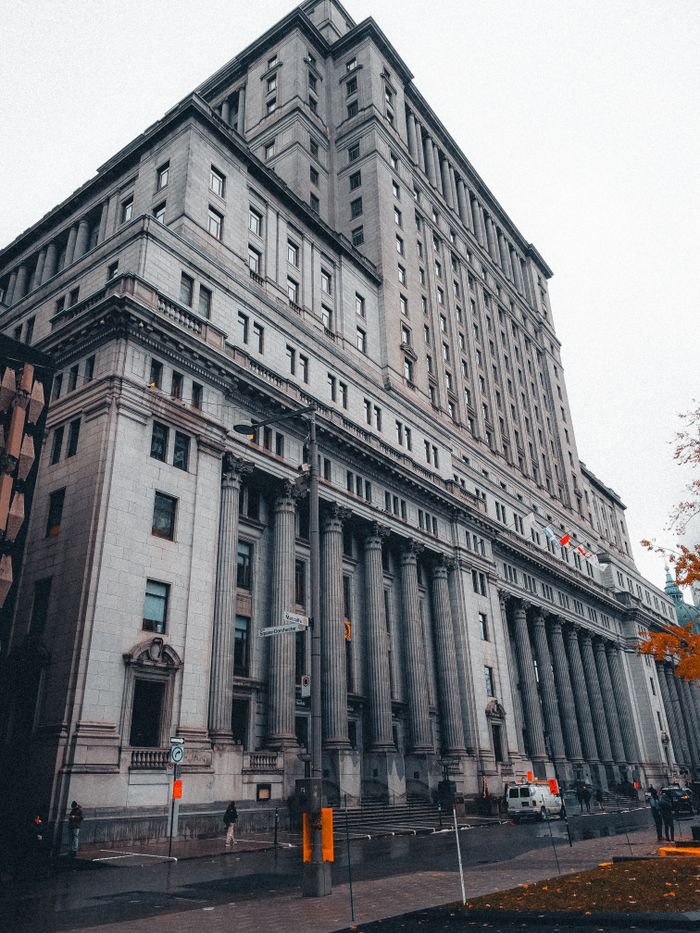 The Sun Life Buildings grand facade in Montreal showcases neoclassical architecture in an urban setting.